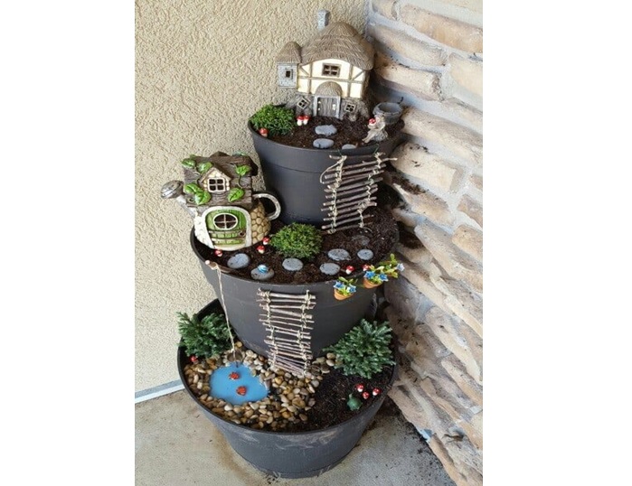 raw and elegant tiered fairy garden from